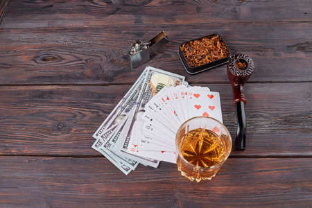 Top view rich men things for leisure. Brown wooden table.