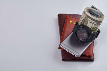 Mens property on white background. Ducments with bunch of money,handwatch and smartphone.の写真素材