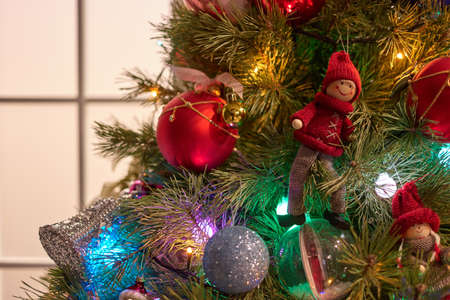 Close up christmas tree with decorations. Different shiny balls.
