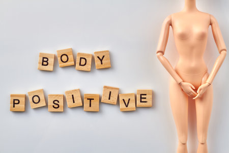 Body positive concept. Plastic female mannequin on white background vertical shot.の写真素材