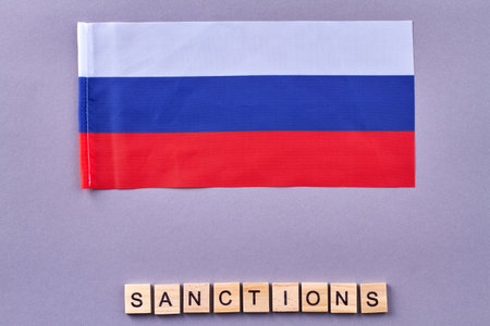 Russian sanctions concept. Wooden cubes on purple background.の写真素材