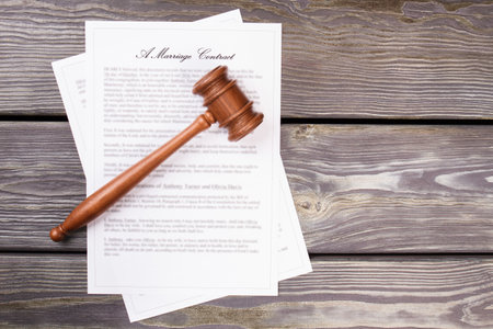 Top view gavel and marriage contract. Grey desk background.の写真素材