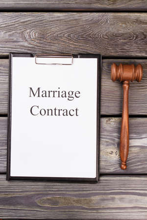Marriage contract with gavel. Top view fat lay vertical shot.の写真素材