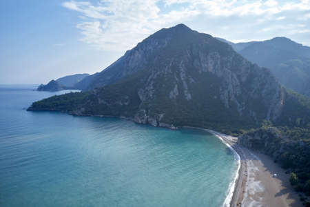 Beautiful nature landscape. Turquoise sea water, coast and mountains in the background. View from above.の写真素材