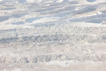 Calcium travertine terraces in Pamukkale, Turkey. Limestone travertine surface.