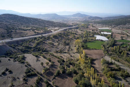 Scenic aerial view of mountain valley with agricultural fields.の写真素材