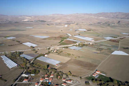 Mountain valley with fields and houses. Beautiful countryside landscape.の写真素材