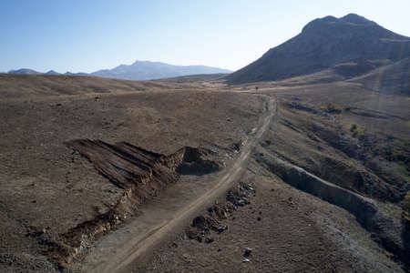 Top view of a mountain valley with a road.の写真素材