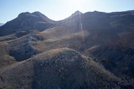 Slopes of a rocky mountains on a summer day.の写真素材