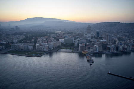 Aerial view of sunset over seaside town.の写真素材