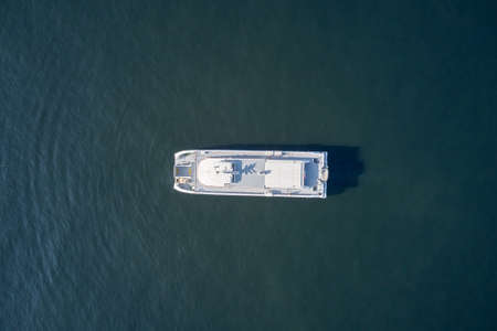 Aerial view of boat on turquoise sea water.