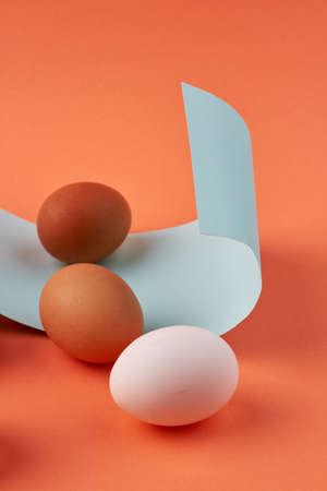 Vertical shot of raw chicken eggs and recipe.