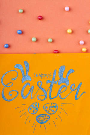 Happy easter handwriting. Yellow paper with happy easter wish.