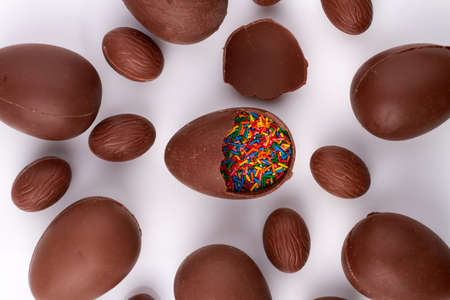 Chocolate easter egg filled with sprinkles.の写真素材