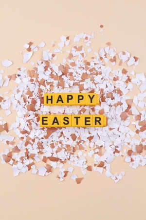 Eggshell pieces and happy easter wish.