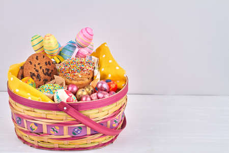Cookies, eggs and cakes in the basket.