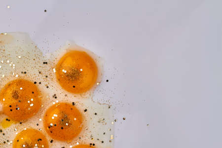Yolks and copy space on white background.