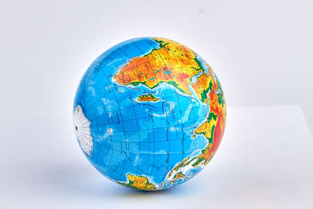 Round colorful school globe isolated on white background.の写真素材