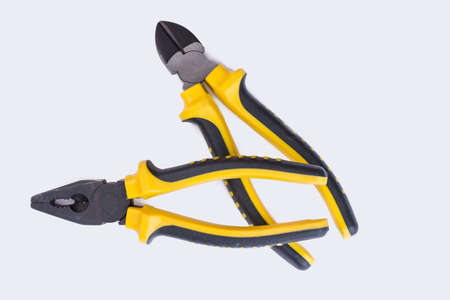 Two pairs of pliers on white background.