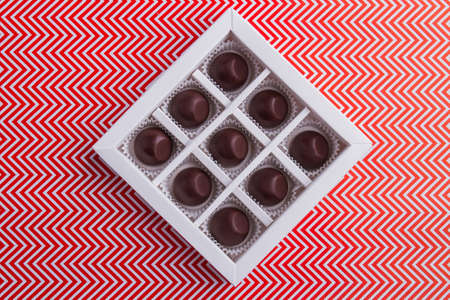 Top view chocolate box with delicious brown candies.の写真素材
