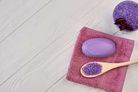 Top view towel with soap and spoon with salt.の写真素材