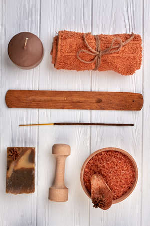 Vertical shot brown spa accessories on white desk.の写真素材