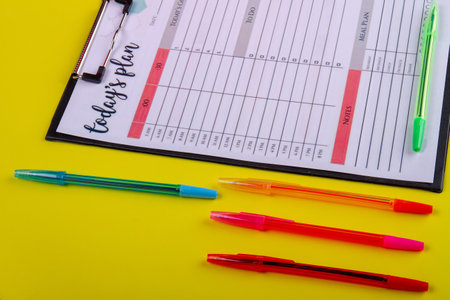 Set colorful pens and week calendar close-up.の写真素材