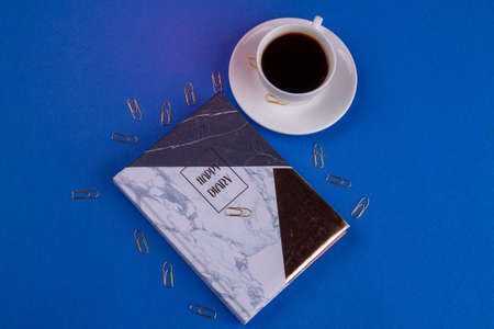 Top view hppy diary with cup of coffee.の写真素材