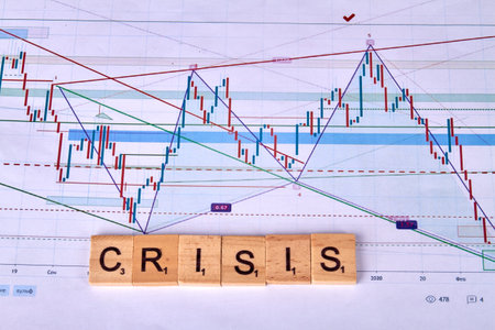 Crisis word of wooden cubes and statistic graphs.の写真素材