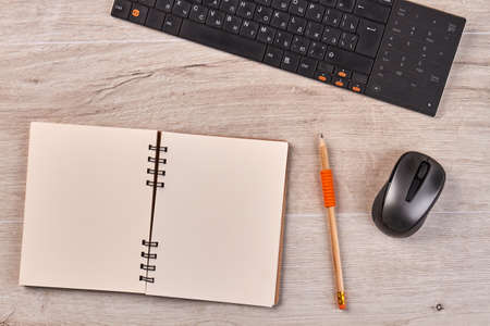 Blank notepad for copy space with pencil and mouse. Top view flat lay.