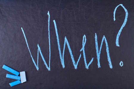 Word When written with blue chalk on black board. School, expectation and education concept.の写真素材