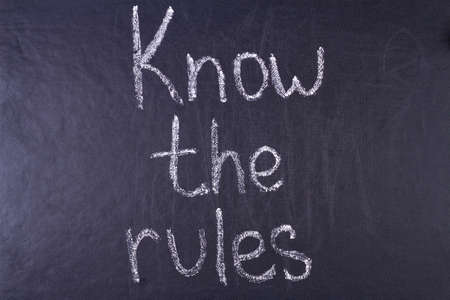 Know the rules inscription written chalk on black board. Business concept.の写真素材