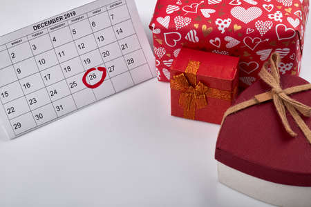 26 of december marked in calendar. Time to open christmas gifts. Boxing day concept. Red presents...