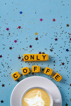 Flat lay cup of coffee and copy space on blue background. Only coffee concept.