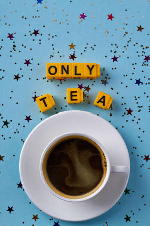 Top view flat lay only tea concept. Vertical shot cup of tea on blue background.