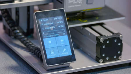 Digital sensor display screen of a working 3d printer. Parameters and touchscreen menu. Modern...