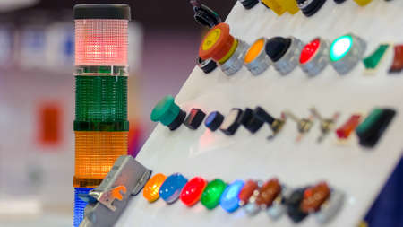 Panel of many colored diode lights and buttons. Control panel of an industrial machine.の写真素材