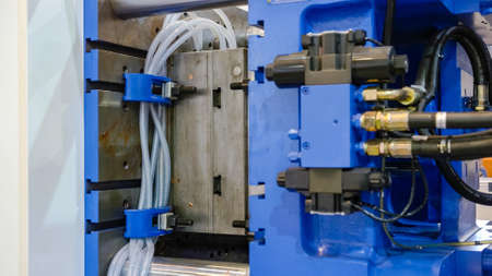 Large industrial equipment. Injection molding machine.