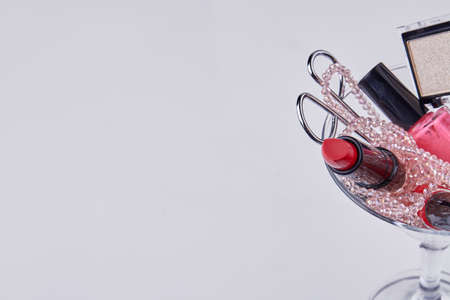 Close up pile of makeup cosmetic accessories. Copy space white background.の写真素材