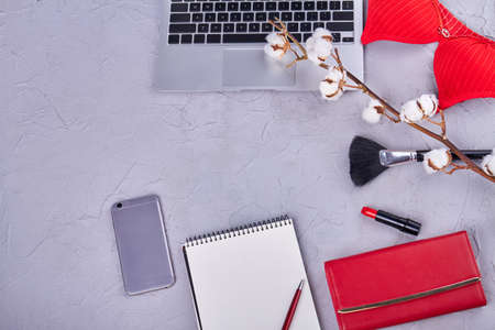 Top view flat lay womans accessories with cotton flower. Work and makeup tools.の写真素材