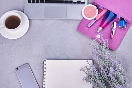 Top view flat lay womans workdesk with copy space. Cup of coffee with laptop and purse.の写真素材