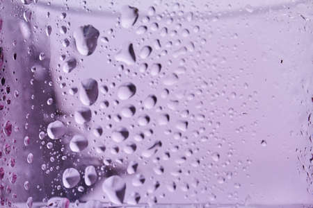 Close up water droplets on the glass. Many drops on transparent surface.の写真素材