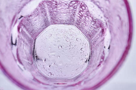 Top view empty glass cup with water droplets. Transparent glass on white background.の写真素材