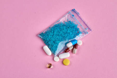 Top view various drugs isolated on pink background. Pills and tablets.の写真素材