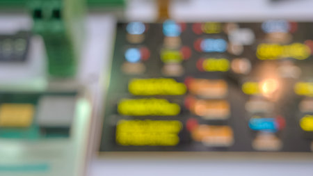 Blurred digital panel board with blinking screen. Defocused graphic technology display.