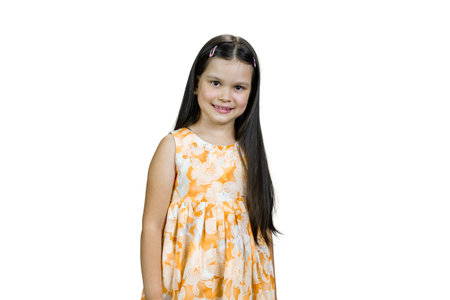 Portrait of happy smiling little girl in dress. Isolated on white.の写真素材