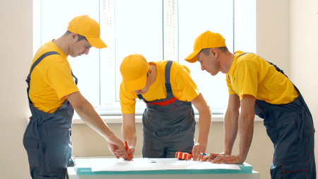 Large construction company discusses the project. Engineers look project.の写真素材