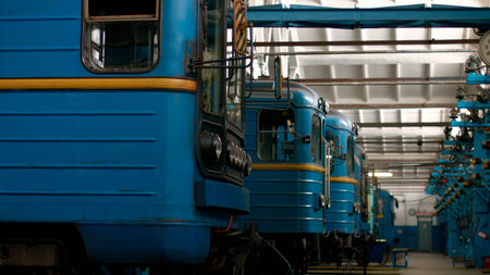 Metro trains are waiting for inspection. Railway depot. The subway building.