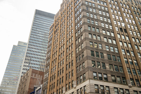A detailed view of classic office buildings and high-rises in Midtown Manhattan. The photo...