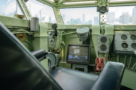 A view from the ships captains chair showcasing navigation gauges, an analog radar screen, and old...